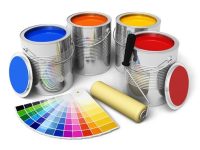 Cans with color paint, roller brush and color guide isolated on white background